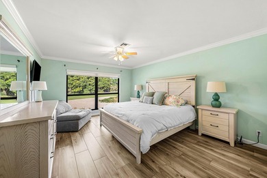 Spacious 3-bedroom, 2-bath condo featuring wood-look tile on Quail Ridge Golf Course and Country Club in Florida - for sale on GolfHomes.com, golf home, golf lot