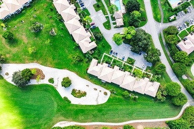 Spacious 3-bedroom, 2-bath condo featuring wood-look tile on Quail Ridge Golf Course and Country Club in Florida - for sale on GolfHomes.com, golf home, golf lot