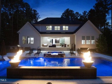 Experience luxury and lifestyle in this exceptional 5-bedroom, 5 on Hasentree Club in North Carolina - for sale on GolfHomes.com, golf home, golf lot