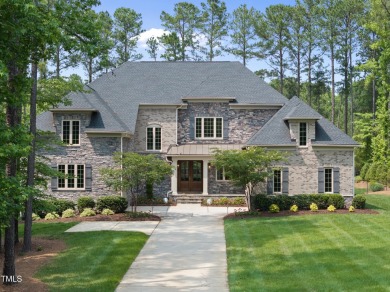 Experience luxury and lifestyle in this exceptional 5-bedroom, 5 on Hasentree Club in North Carolina - for sale on GolfHomes.com, golf home, golf lot