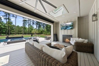 Experience luxury and lifestyle in this exceptional 5-bedroom, 5 on Hasentree Club in North Carolina - for sale on GolfHomes.com, golf home, golf lot