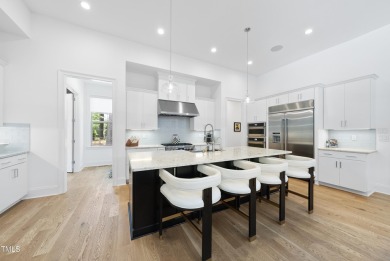 Experience luxury and lifestyle in this exceptional 5-bedroom, 5 on Hasentree Club in North Carolina - for sale on GolfHomes.com, golf home, golf lot