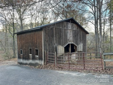 Tucked away in the woods, this 2-bedroom, 2-bathroom home on on River Oaks Country Club in North Carolina - for sale on GolfHomes.com, golf home, golf lot