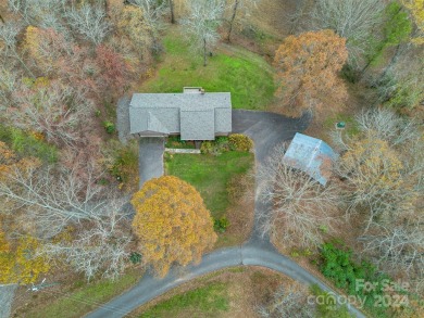 Tucked away in the woods, this 2-bedroom, 2-bathroom home on on River Oaks Country Club in North Carolina - for sale on GolfHomes.com, golf home, golf lot