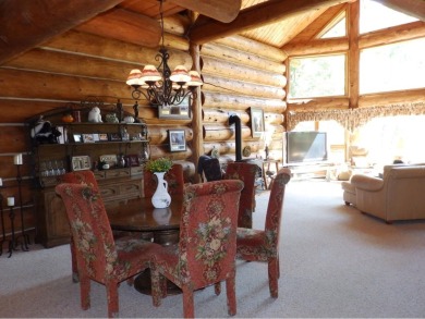 This stunning log home located on the 6th tee of Garland's on Garland Resort and Golf Club  in Michigan - for sale on GolfHomes.com, golf home, golf lot