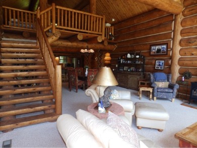 This stunning log home located on the 6th tee of Garland's on Garland Resort and Golf Club  in Michigan - for sale on GolfHomes.com, golf home, golf lot