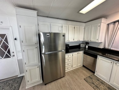 This beautiful 2-bedroom, 2-bathroom Barrington home is being on Del Tura Golf and Country Club in Florida - for sale on GolfHomes.com, golf home, golf lot