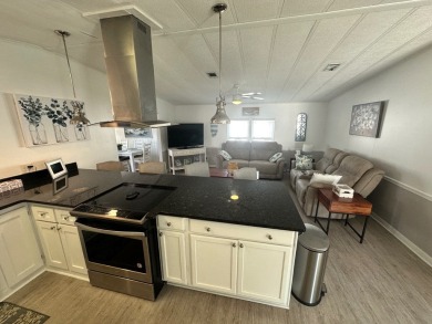 This beautiful 2-bedroom, 2-bathroom Barrington home is being on Del Tura Golf and Country Club in Florida - for sale on GolfHomes.com, golf home, golf lot