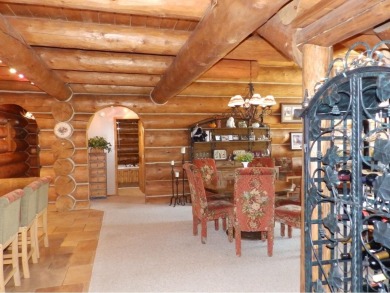 This stunning log home located on the 6th tee of Garland's on Garland Resort and Golf Club  in Michigan - for sale on GolfHomes.com, golf home, golf lot