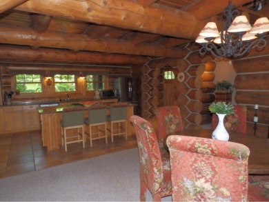 This stunning log home located on the 6th tee of Garland's on Garland Resort and Golf Club  in Michigan - for sale on GolfHomes.com, golf home, golf lot