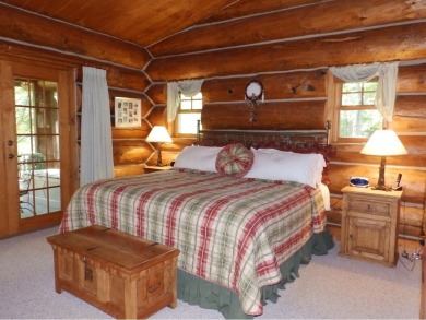 This stunning log home located on the 6th tee of Garland's on Garland Resort and Golf Club  in Michigan - for sale on GolfHomes.com, golf home, golf lot