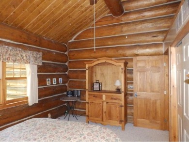 This stunning log home located on the 6th tee of Garland's on Garland Resort and Golf Club  in Michigan - for sale on GolfHomes.com, golf home, golf lot