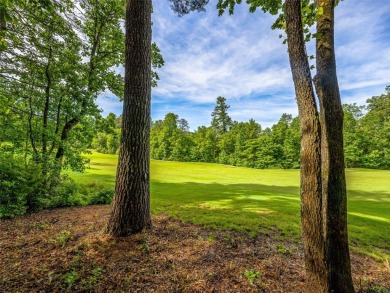 Located off Cherokee Point, this private .915-acre homesite on Lake Toxaway Country Club in North Carolina - for sale on GolfHomes.com, golf home, golf lot
