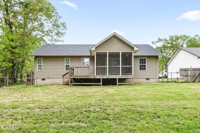 Nestled in the desirable Lake Tansi Village community of on Lake Tansi Village Country Club in Tennessee - for sale on GolfHomes.com, golf home, golf lot