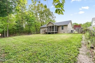 Nestled in the desirable Lake Tansi Village community of on Lake Tansi Village Country Club in Tennessee - for sale on GolfHomes.com, golf home, golf lot