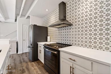 Fully renovated and thoughtfully designed in Timber Ridge, this on Pass Christian Isles Golf Club in Mississippi - for sale on GolfHomes.com, golf home, golf lot