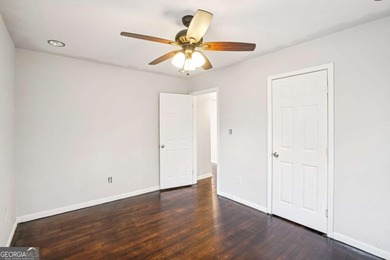 Charming brick ranch on a basement, perfectly positioned in a on Browns Mill Golf Course in Georgia - for sale on GolfHomes.com, golf home, golf lot