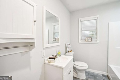 Charming brick ranch on a basement, perfectly positioned in a on Browns Mill Golf Course in Georgia - for sale on GolfHomes.com, golf home, golf lot