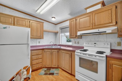Located in the desirable Fox Run 55+ community, this on Bay Tree Golf Course in Florida - for sale on GolfHomes.com, golf home, golf lot