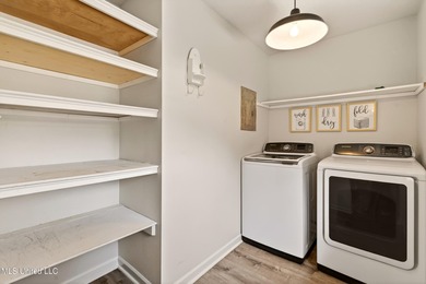 Fully renovated and thoughtfully designed in Timber Ridge, this on Pass Christian Isles Golf Club in Mississippi - for sale on GolfHomes.com, golf home, golf lot