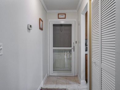 Completely redone with tile floors throughout, updated kitchen on Monterey Yacht and Country Club in Florida - for sale on GolfHomes.com, golf home, golf lot