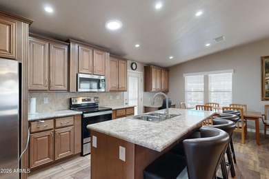 ON LEASED LAND: Step inside this absolutely stunning 2 bedroom 2 on Pueblo Golf Course in Arizona - for sale on GolfHomes.com, golf home, golf lot