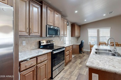 ON LEASED LAND: Step inside this absolutely stunning 2 bedroom 2 on Pueblo Golf Course in Arizona - for sale on GolfHomes.com, golf home, golf lot