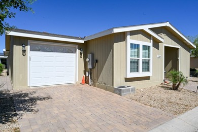 ON LEASED LAND: Step inside this absolutely stunning 2 bedroom 2 on Pueblo Golf Course in Arizona - for sale on GolfHomes.com, golf home, golf lot
