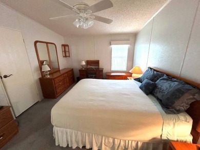This beautifully maintained 2-bedroom, 2-bathroom home is being on Crystal Lake Club in Florida - for sale on GolfHomes.com, golf home, golf lot