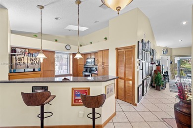 This beautiful 2-bedroom, 2-bath townhome features vaulted on Woodmont Country Club in Florida - for sale on GolfHomes.com, golf home, golf lot