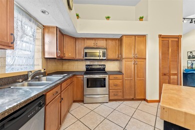 This beautiful 2-bedroom, 2-bath townhome features vaulted on Woodmont Country Club in Florida - for sale on GolfHomes.com, golf home, golf lot