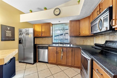 This beautiful 2-bedroom, 2-bath townhome features vaulted on Woodmont Country Club in Florida - for sale on GolfHomes.com, golf home, golf lot