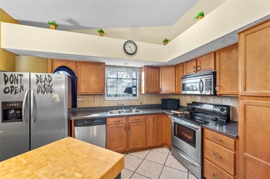 This beautiful 2-bedroom, 2-bath townhome features vaulted on Woodmont Country Club in Florida - for sale on GolfHomes.com, golf home, golf lot