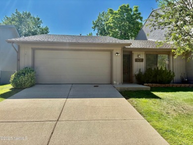 Discover a peaceful single-level home steps away from the golf on Aspen Valley Golf Club in Arizona - for sale on GolfHomes.com, golf home, golf lot