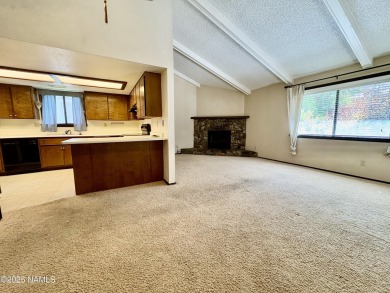 Discover a peaceful single-level home steps away from the golf on Aspen Valley Golf Club in Arizona - for sale on GolfHomes.com, golf home, golf lot
