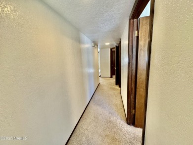 Discover a peaceful single-level home steps away from the golf on Aspen Valley Golf Club in Arizona - for sale on GolfHomes.com, golf home, golf lot