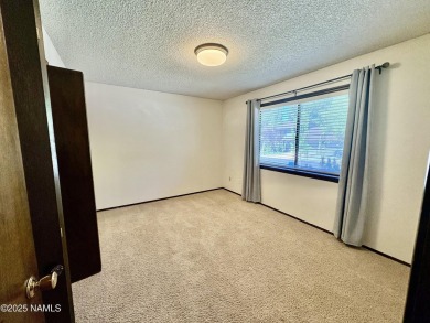 Discover a peaceful single-level home steps away from the golf on Aspen Valley Golf Club in Arizona - for sale on GolfHomes.com, golf home, golf lot