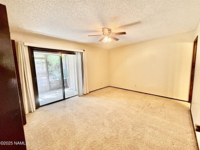 Discover a peaceful single-level home steps away from the golf on Aspen Valley Golf Club in Arizona - for sale on GolfHomes.com, golf home, golf lot