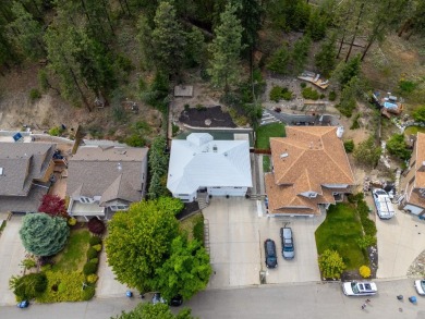 This 4-bed, 3-bath family home is in North Glenmore's heart on  in  - for sale on GolfHomes.com, golf home, golf lot