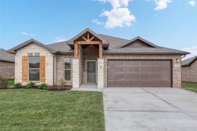 This traditional ranch-style new home is complemented by a on Heritage Park Golf Course in Kansas - for sale on GolfHomes.com, golf home, golf lot