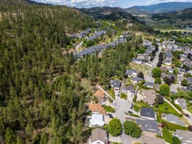 This 4-bed, 3-bath family home is in North Glenmore's heart on  in  - for sale on GolfHomes.com, golf home, golf lot