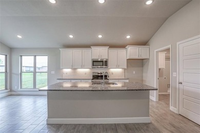 This traditional ranch-style new home is complemented by a on Heritage Park Golf Course in Kansas - for sale on GolfHomes.com, golf home, golf lot