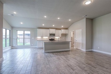 This traditional ranch-style new home is complemented by a on Heritage Park Golf Course in Kansas - for sale on GolfHomes.com, golf home, golf lot