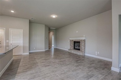 This traditional ranch-style new home is complemented by a on Heritage Park Golf Course in Kansas - for sale on GolfHomes.com, golf home, golf lot