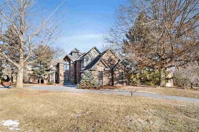 Situated on over a half-acre double lot among mature trees and on Brown Deer Golf Club in Iowa - for sale on GolfHomes.com, golf home, golf lot