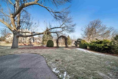 Situated on over a half-acre double lot among mature trees and on Brown Deer Golf Club in Iowa - for sale on GolfHomes.com, golf home, golf lot