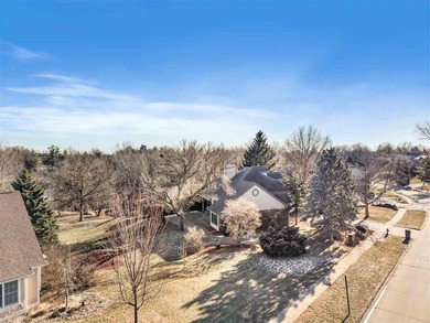 Situated on over a half-acre double lot among mature trees and on Brown Deer Golf Club in Iowa - for sale on GolfHomes.com, golf home, golf lot