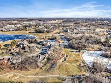 Situated on over a half-acre double lot among mature trees and on Brown Deer Golf Club in Iowa - for sale on GolfHomes.com, golf home, golf lot