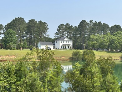 Level building lot with Boat Slip #2 (Tax Map #162-10-00-178-00) on Players Course At Wyboo Plantation in South Carolina - for sale on GolfHomes.com, golf home, golf lot
