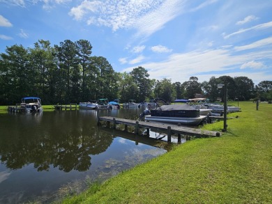 Beautiful .50-acre level building lot with a Boat Slip in Wyboo on Players Course At Wyboo Plantation in South Carolina - for sale on GolfHomes.com, golf home, golf lot